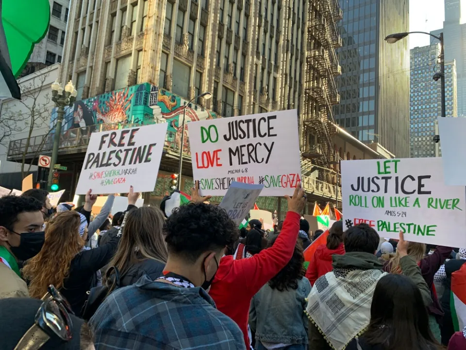 Protest with signs such as "Free Palestine," "Do Justice Love Mercy".